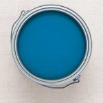 Aeial view of an open gallon can of bright blue paint