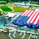 A massive American flag painted on the roof of the boat storage building at Legendary Marine in Destin, Florida