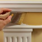 a contractor painting a perfectly prepped mantlepiece