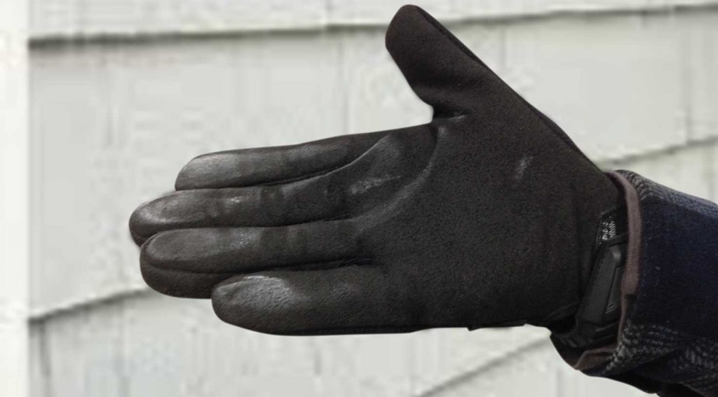 white aluminum oxide visible on a black gloved hand
