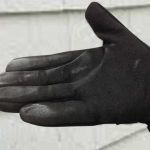 white aluminum oxide visible on a black gloved hand