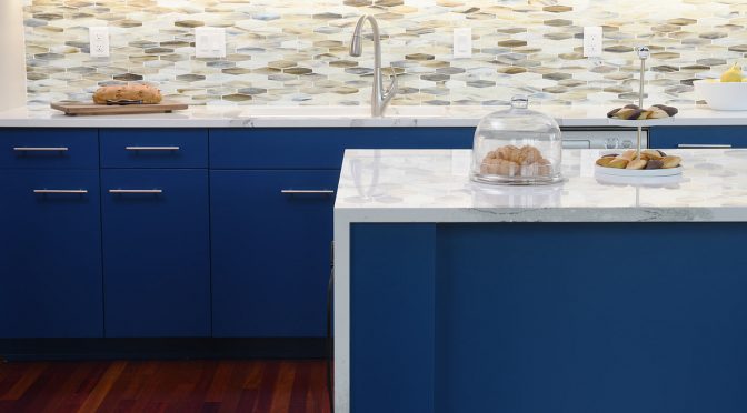 a kitchen remodel featuring bold blue painted cabinetry