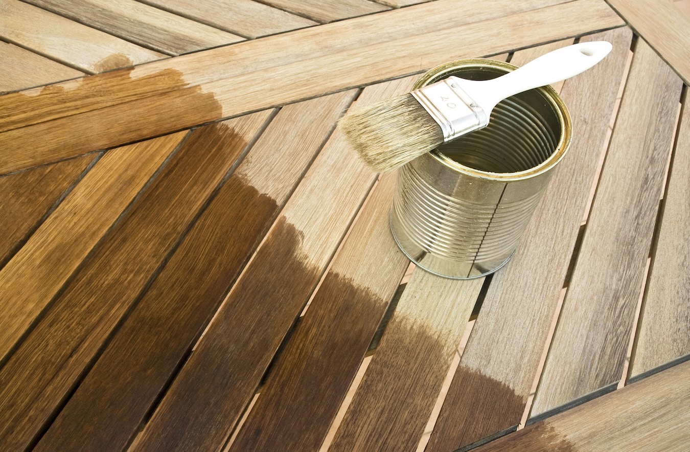Staining a deck with a brush