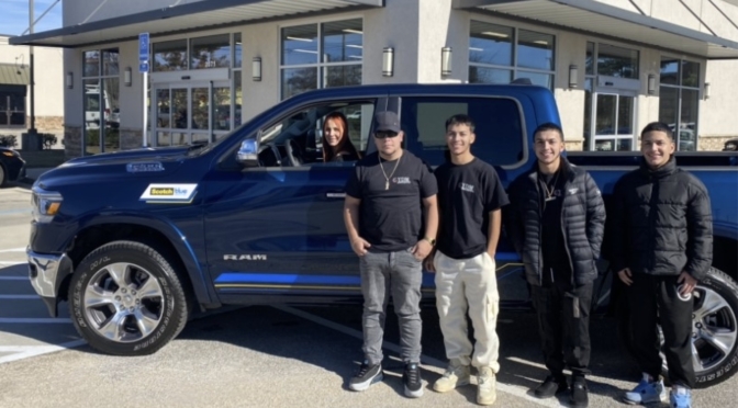 YDM Painting family with their new RAM truck