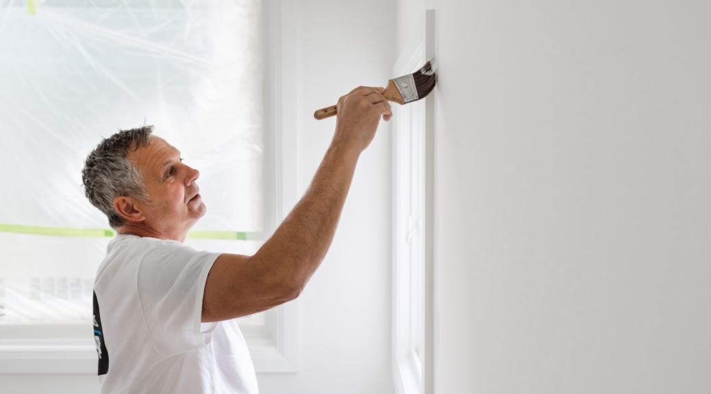 Pro painter at work painting residence