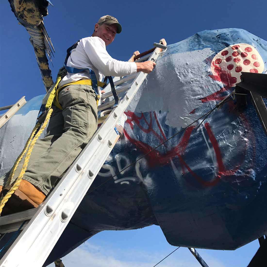 Pros painting the Big Blue Bug in Rhode Island